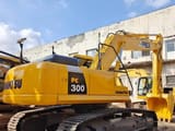 2014 Komatsu PC300 crawler excavator, rear three-quarter view