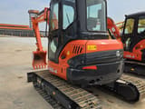 2021 Kubota U55-4 mini excavator, rear three-quarter view