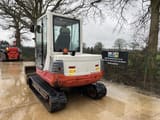 2015 Takeuchi TB250 mini excavator, rear three-quarter view