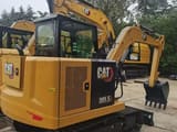 2023 Caterpillar 305.5E2 mini excavator, rear three-quarter view