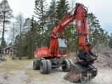 1992 Atlas 1304 wheel excavator, front three-quarter view