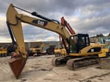 Escavatore cingolato Caterpillar 320D del 2012, vista laterale