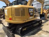 2023 Caterpillar 308E2 mini excavator, rear three-quarter view