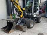 2023 Wacker Neuson EW65 wheel excavator, front three-quarter view