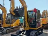 2025 Caterpillar 306 mini excavator, front three-quarter view