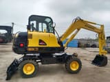 2016 Hyundai 60W-7 wheel excavator, side profile view