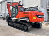 2022 Doosan DX225LCA crawler excavator, rear three-quarter view