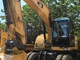 2019 Caterpillar M315D wheel excavator, front three-quarter view