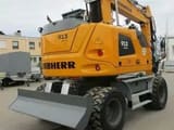 2023 Liebherr A 913 Compact wheel excavator, rear three-quarter view