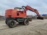 1988 Case Poclain 61P wheel excavator, side profile view