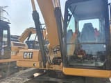 2019 Caterpillar 320GC crawler excavator cab and boom view