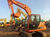 2022 Doosan DH80G mini excavator, rear three-quarter view