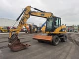 2008 Caterpillar M313D wheel excavator, front three-quarter view