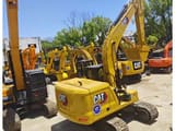2023 Caterpillar 320GC crawler excavator, rear three-quarter view