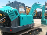 2024 Kobelco SK60-C crawler excavator, rear three-quarter view with engine cover open