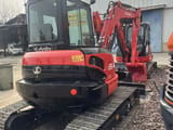 2024 Kubota U55-4 mini excavator, front three-quarter view