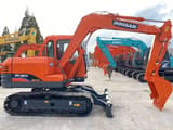2023 Doosan DH80 Gold mini excavator, side profile view