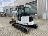 2022 Caterpillar 303.5CR-07 mini excavator, rear three-quarter view