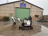 Bobcat E10Z mini excavator, side profile view