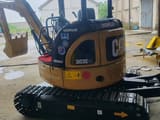 2022 Caterpillar 303E CR mini excavator, rear three-quarter view
