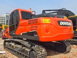 2023 Doosan DX225LC-9C excavator, rear three-quarter view
