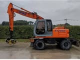 2002 New Holland EX165W wheel excavator, side profile view