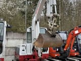 2018 Takeuchi TB250 mini excavator, front three-quarter view