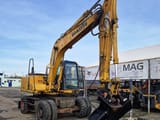 1998 Komatsu PW130ES-6K wheel excavator, side view