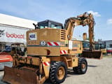 1997 CASE 788 wheel excavator, rear three-quarter view