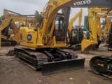 2023 Komatsu PC128US crawler excavator, front three-quarter view