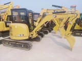 2023 Caterpillar 303.5E mini excavator, rear three-quarter view
