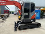 2023 Hitachi Zaxis 55 mini excavator, rear three-quarter view