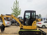 2023 Caterpillar 303.5E2 mini excavator, side view