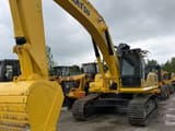 2025 Komatsu PC300 crawler excavator, front three-quarter view