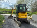 2021 New Holland E26C mini excavator, rear three-quarter view