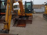 2023 Komatsu PC80MR-5 crawler excavator, front three-quarter view