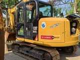 2022 Caterpillar 307E2 excavator, rear three-quarter view