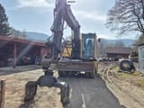 2005 Volvo EW140B wheel excavator, front view with grapple attachment