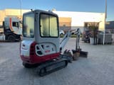 2021 Takeuchi TB216 mini excavator, rear three-quarter view