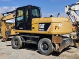 2011 Caterpillar M315D wheel excavator, rear three-quarter view