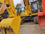 2025 Komatsu PC210LC-7 crawler excavator, front three-quarter view