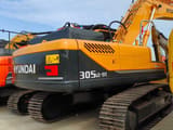 2023 Hyundai 305LC-9T crawler excavator, rear three-quarter view