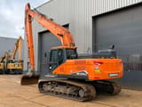 2022 Doosan DX225LC-7 crawler excavator, rear three-quarter view