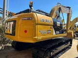 Escavatore cingolato Caterpillar 320DL del 2020, vista posteriore tre quarti
