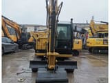 2023 Caterpillar 305.5E2 mini excavator, front view