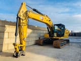 2021 Caterpillar 323 crawler excavator, front three-quarter view