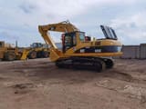 2010 Caterpillar 325C crawler excavator, side profile view