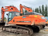 2023 Doosan DX380LC-9C excavator, rear three-quarter view