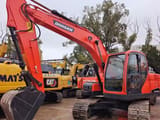 Doosan DX140 crawler excavator, front three-quarter view
