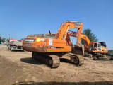 2025 Doosan DX300LCA crawler excavator, rear three-quarter view